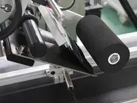 Etichettatrice automatica per l'applicazione superiore